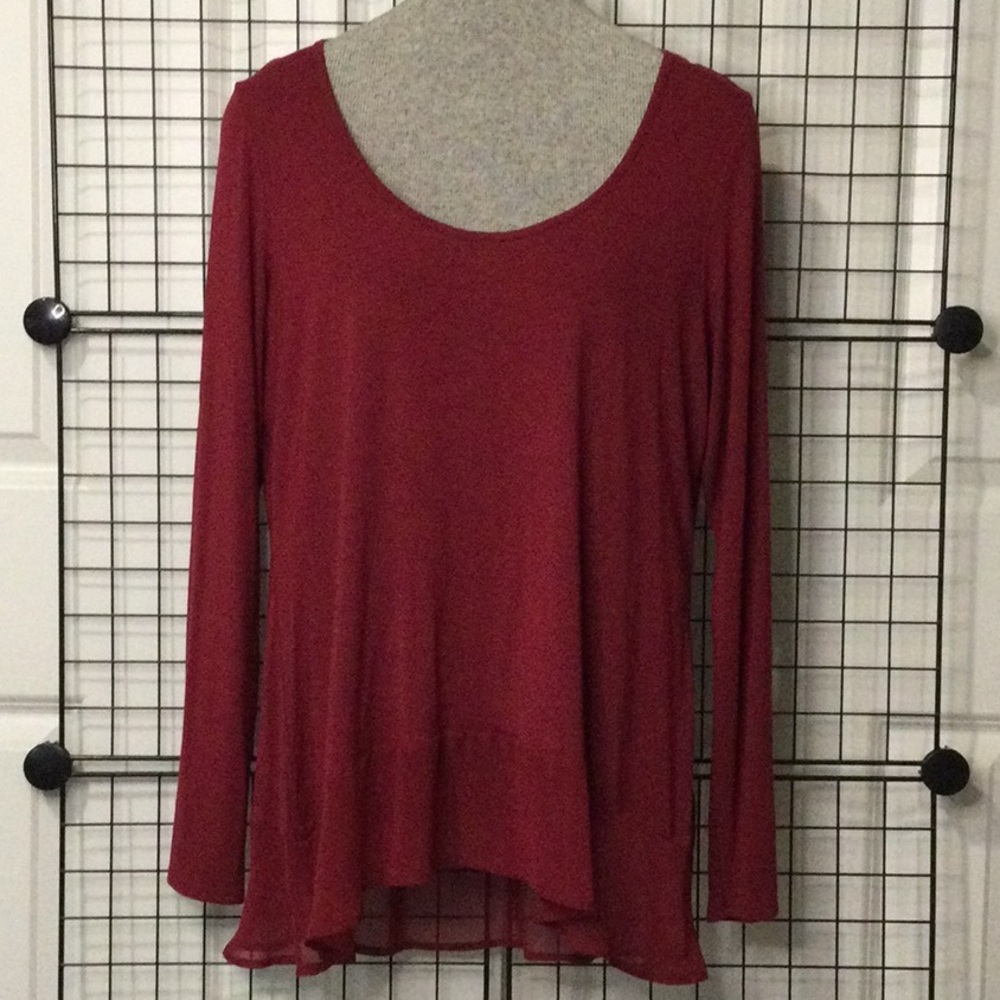New. Comfy top, uneven shear hem with ruffle. NWT